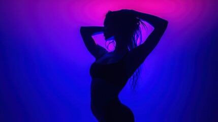 Silhouette of a woman in blue and pink neon light.