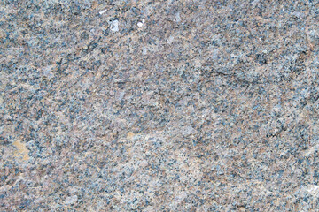 The texture of the granular granite in the photo shows a light stone with a fine granular structure