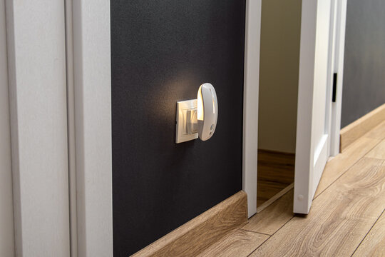 Lamp is plugged into a socket. Night lamp with motion sensor