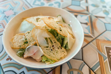 Caesar salad with crackers on a beautiful plate