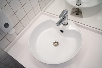 White sink in the public bathroom, modern design.