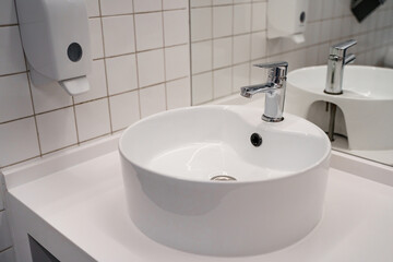 White sink in the public bathroom, modern design.