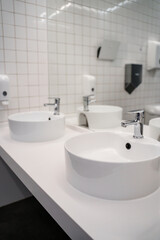 White sink in the public bathroom, modern design.