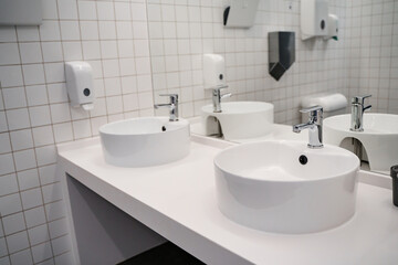 White sink in the public bathroom, modern design.
