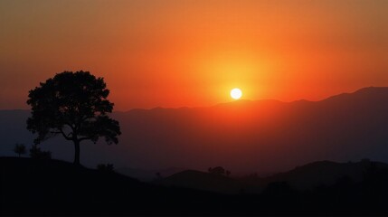 Serene Sunset Over Mountain Silhouettes - A Picturesque Nature Scene