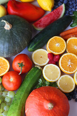 Various seasonal fruits and vegetables on white background. Summer and fall produce. Selective focus.