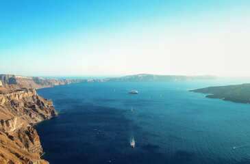 Picturesque view on caldera and bay. Santorini Island, Volcano caldera, view on a cruise ship and Aegean Sea.