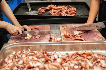 Close shot for preparing and cutting octopus. 