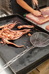 Close shot for preparing and cutting octopus. 