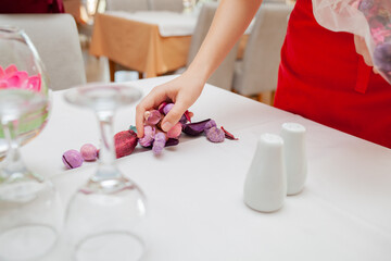 Close shot, no face for arranging tableware in restaurant by waiter