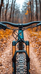 a mountain bike on a dirt road in the fall