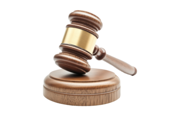 A wooden gavel with a gold band, resting on a base, against a black background.