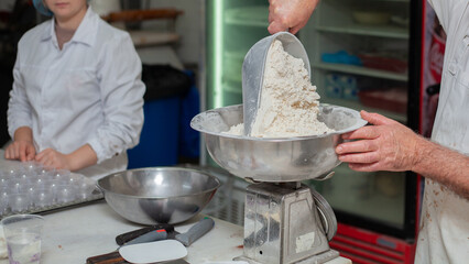 Close shot for preparing pastry and desserts, rolling dough, measuring ingredients, putting together elements 