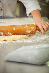 Close shot for preparing pastry and desserts, rolling dough, measuring ingredients, putting together elements 