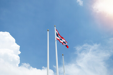 Thailand flag isolated on the blue sky with clipping path. close up waving flag of Thailand. flag...