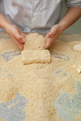 Shot for coating cheese in breadcrumbs in restaurant kitchen