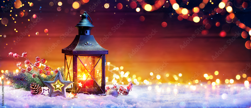 Wall mural christmas lantern with fir branch and decoration on snowy table - abstract bokeh lights on backgroun