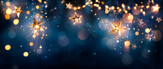 Christmas Stars string Lights On Blue Night - Abstract Defocused Bokeh In Background