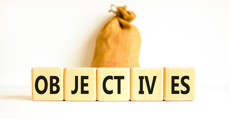 Objectives symbol. Concept word Objectives on beautiful wooden blocks. Beautiful white background....