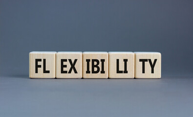 Flexibility symbol. Concept word Flexibility on beautiful wooden blocks. Beautiful grey background....