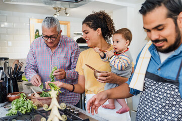 Latin family cooking together for Christmas dinner at home in Mexico Latin America, hispanic...