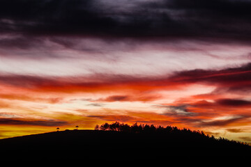 Magical orange pink blue yellow sky. Sunset with incredible colors.