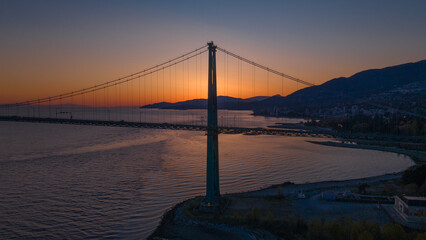 Aerial view of Lions Gate bridge in Vancouver during Sunset