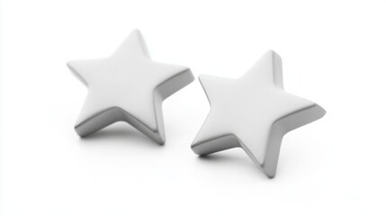 Obraz premium Two star-shaped earrings made of polished silver rest on a clean, white surface, showcasing their elegant design and modern aesthetic, perfect for adding a touch of charm to any outfit.