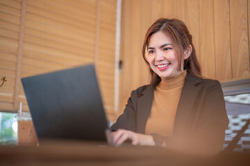 Confident Businesswoman Conducting Online Work with Enthusiasm