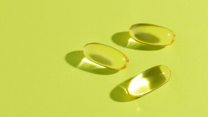 Soft gels pills with Omega-3 oil close-up. Vitamin D, multivitamins, Calcium. Health and Immunity concept
