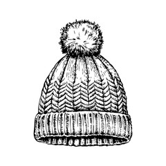 Warm winter knitted hat with pom pom. On a white background