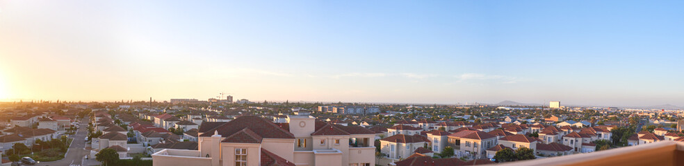 City, landscape and banner with sky at sunset for travel destination, infrastructure or outdoor view. Evening, scenery and background with buildings at town for holiday, tourism or vacation in Italy