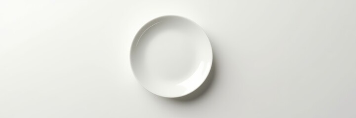 A minimalistic white plate against a neutral background, perfect for culinary presentations, dining concepts, or food-related marketing.