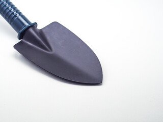 Small earthen shovel isolated on a white background, this shovel is suitable for gardening
