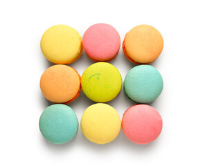 Different tasty sweet macaroons on white background