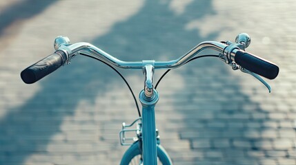 Close-up of a bike handlebar at a bike-sharing dock, with copy space on a clean background.
