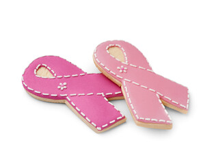 Cookies in shape of pink ribbon on white background. Breast cancer awareness concept