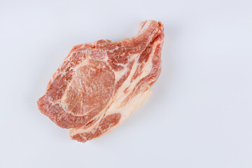 Raw pork steaks ready to marinate in row