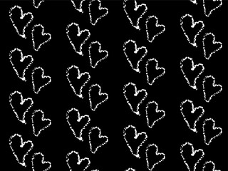 Seamless crayon pattern with white hearts on black background. Minimalistic Romantic background with love symbol. Chalk drawn sketch tender hearts on chalkboard backdrop.