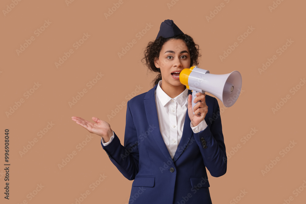 Canvas Prints Beautiful African-American stewardess with megaphone on beige background