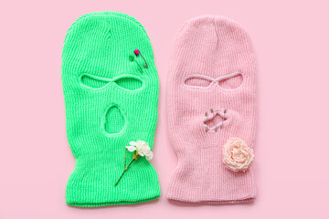 Balaclavas with safety pink and flowers on pink background