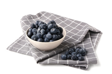 Bowl with tasty blueberry and napkin isolated on white background