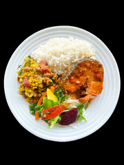 plate of food with rice beans salad and meat healthy food