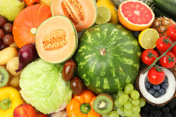 Different fresh vegetables and fruits as background, top view