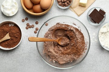 Ingredients for chocolate dough on light table, flat lay