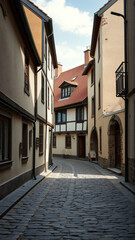 Obraz premium Narrow cobblestone street in a charming European village during daylight