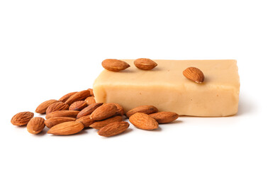 Bar of tasty marzipan bar and almond nuts on white background