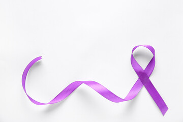 Purple ribbon on white background. World Cancer Day