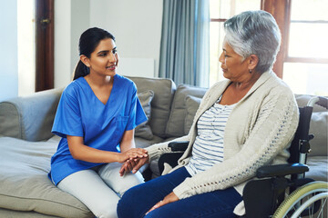 Elderly woman, wheelchair and holding hands with nurse for consultation, care or recovery support....