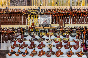 Belts and jambiya daggers for sale on a market in Najran, Saudi Arabia